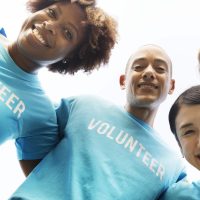 Group of happy and diverse volunteers